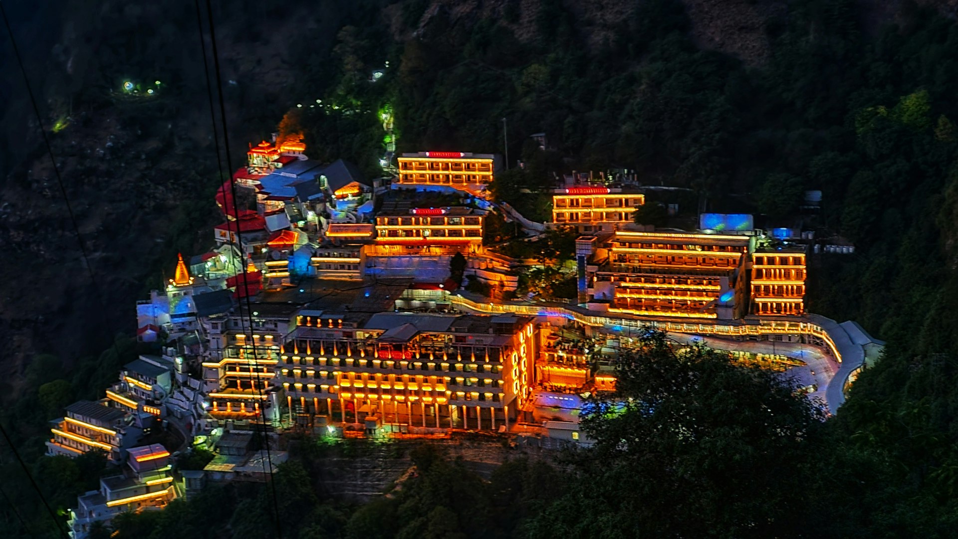 An aerial view of a city lit up at night